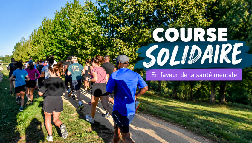 Photo de la course solidaire montrant des coureurs de dos